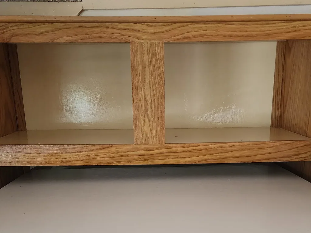 The same kitchen cabinets emptied and wiped clean inside and out.